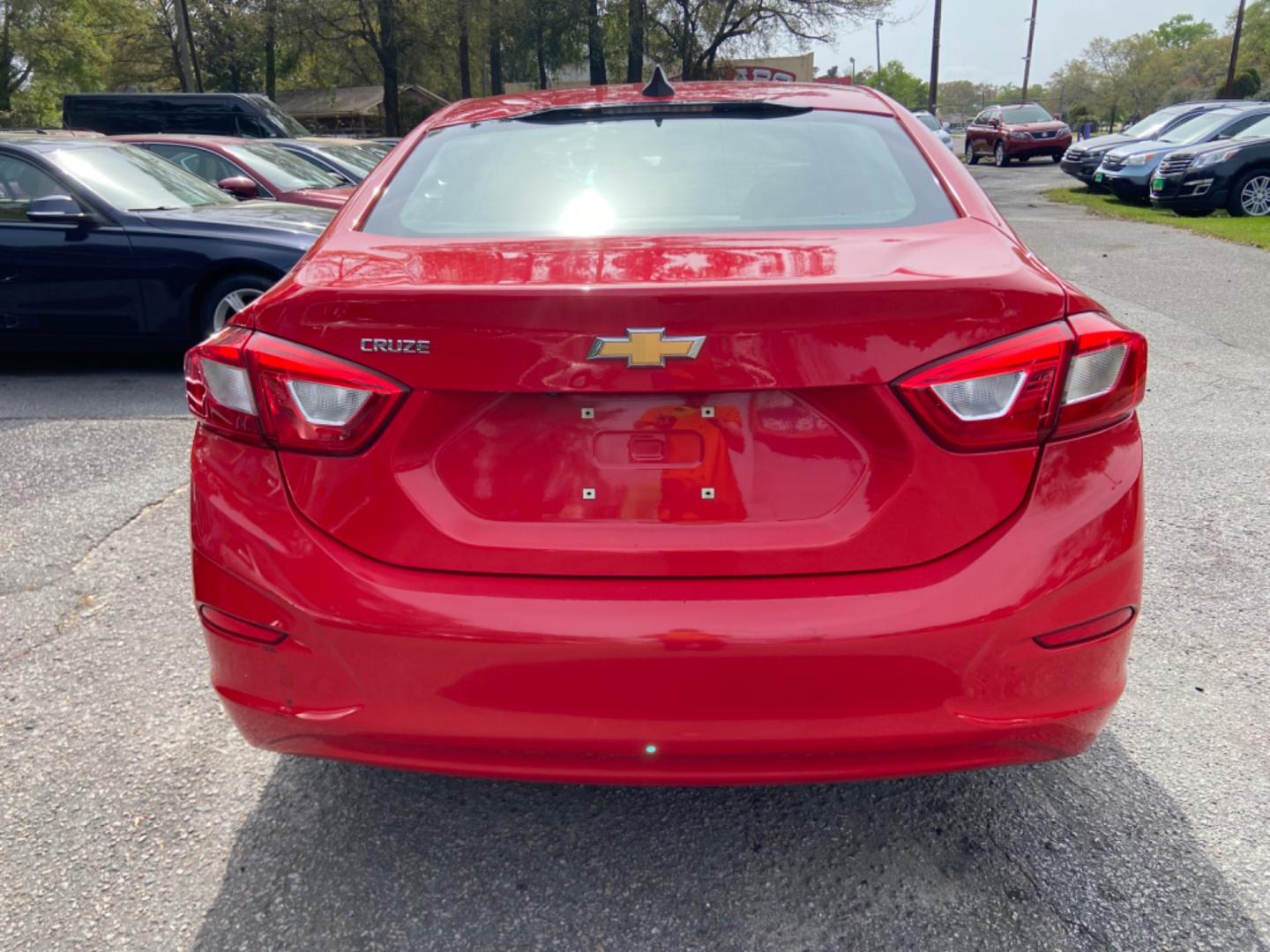 2016 RED CHEVROLET CRUZE LS AUTO (1G1BC5SM7G7) with an 1.4L engine, Automatic transmission, located at 5103 Dorchester Rd., Charleston, SC, 29418-5607, (843) 767-1122, 36.245171, -115.228050 - Photo#5